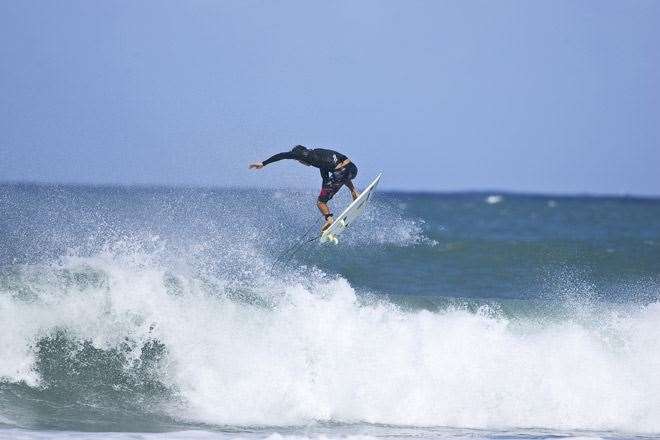 Corey Lopez getting high at Rock Point. Photo by Peter Joli Wilson.