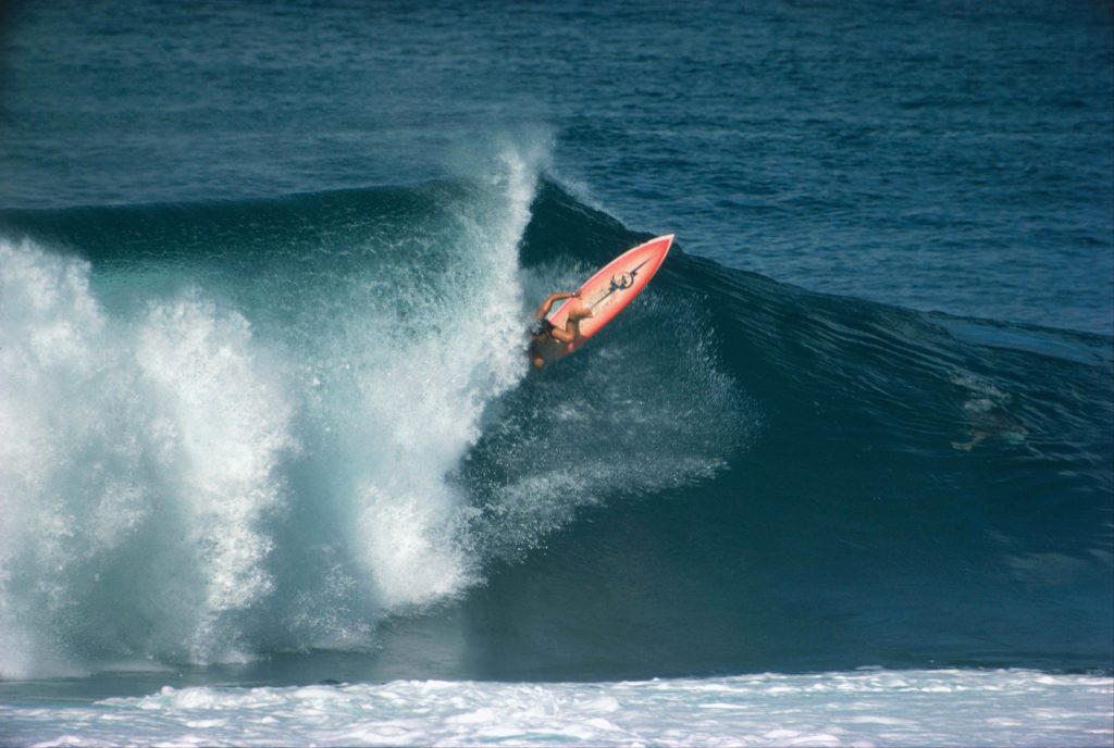 Shaun hooking under the lip at Pipe on his Spider Murphy Pink Banana.